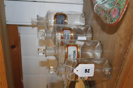 Four Chemist glass bottles